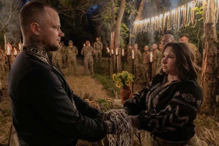 'Life goes on': Amid war, Ukrainian soldiers celebrate love at ritual wedding